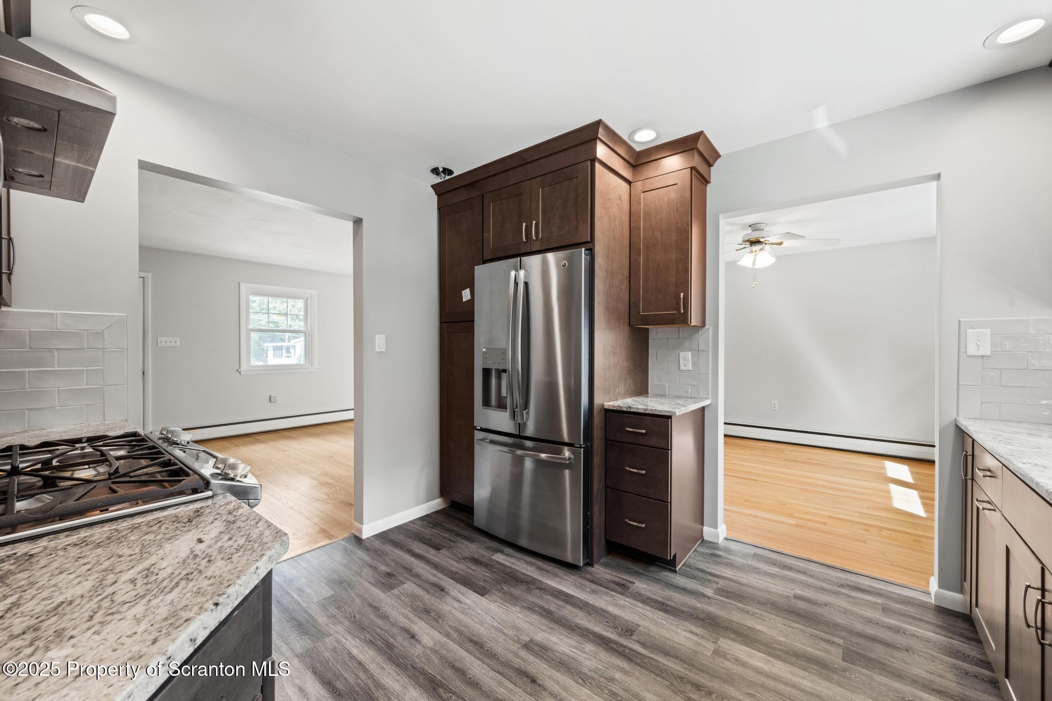 525 Knapp Road Clarks Summit, PA 18411 - Photo 12 of 45 a kitchen with stainless steel appliances granite countertop a refrigerator and a stove top oven