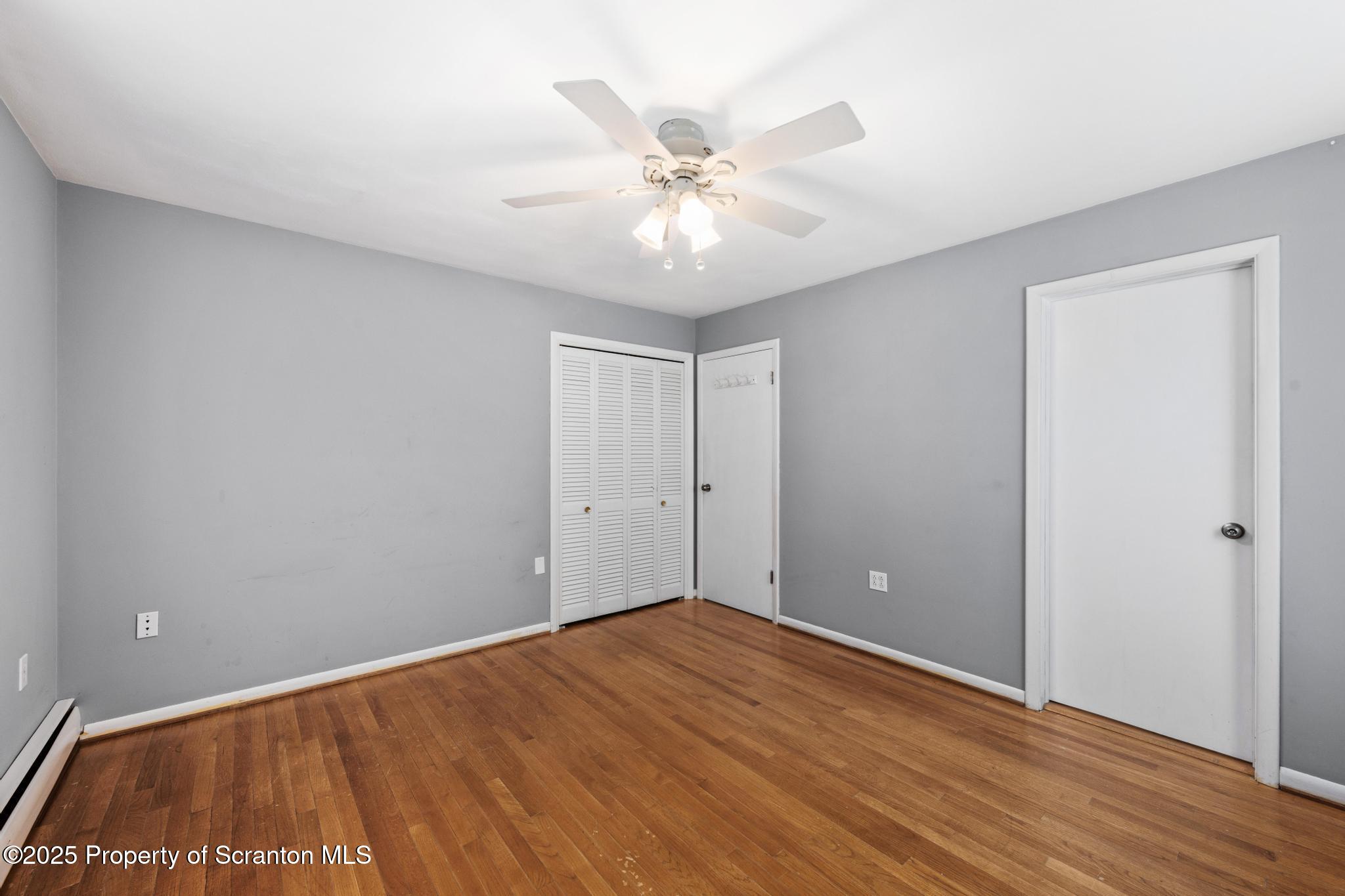 525 Knapp Road Clarks Summit, PA 18411 - Photo 16 of 45 a view of an empty room with wooden floor