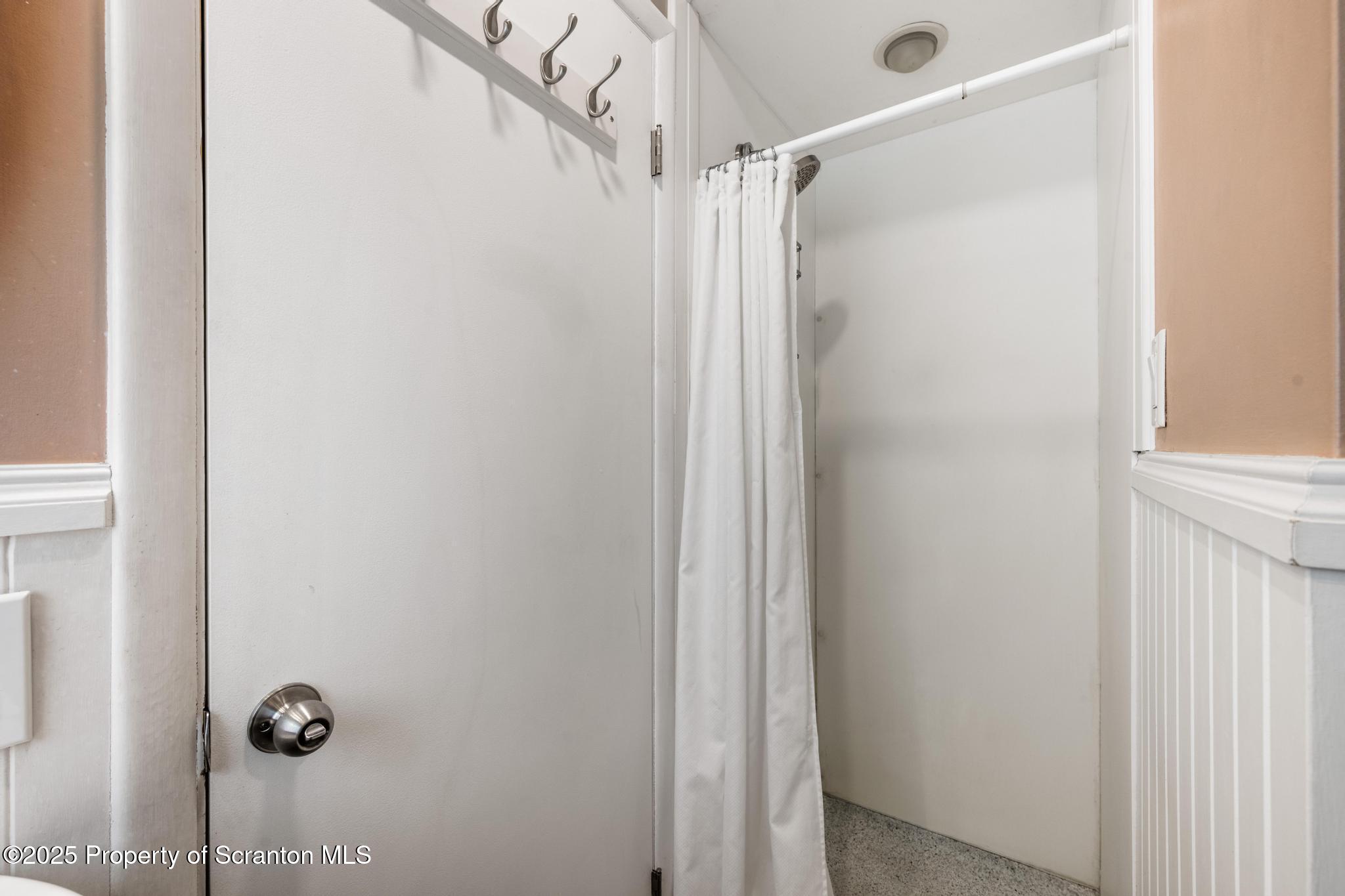 525 Knapp Road Clarks Summit, PA 18411 - Photo 18 of 45 a bathroom with a glass shower door