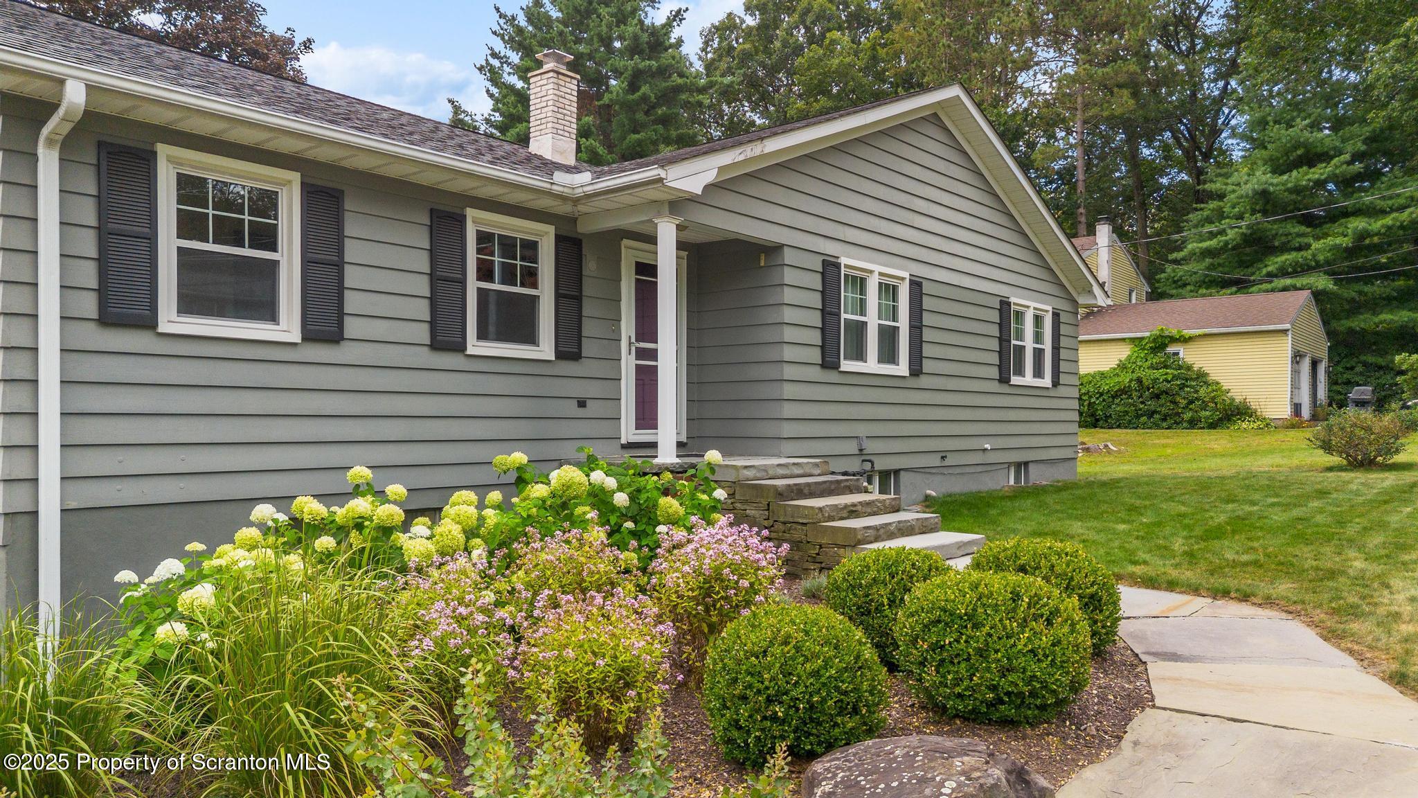525 Knapp Road Clarks Summit, PA 18411 - Photo 2 of 45 a front view of a house with garden