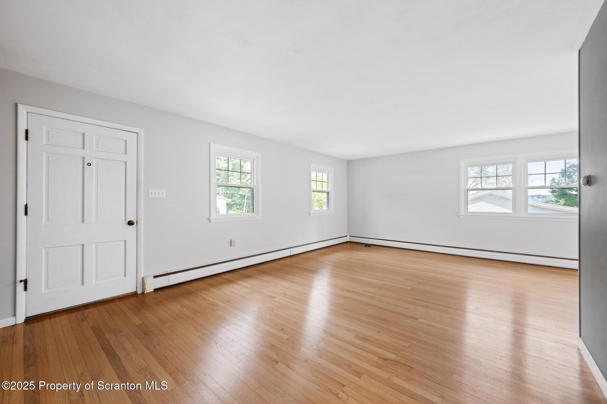 525 Knapp Road Clarks Summit, PA 18411 - Photo 26 of 45 a view of an empty room with wooden floor and a window