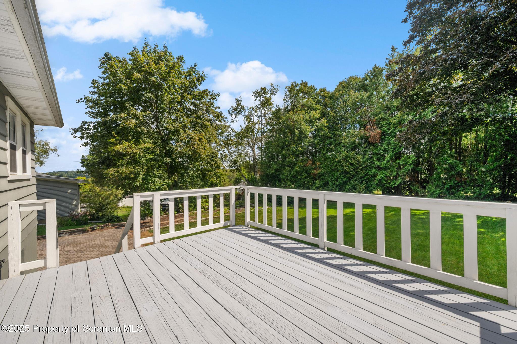 525 Knapp Road Clarks Summit, PA 18411 - Photo 36 of 45 a balcony with wooden floor and fence