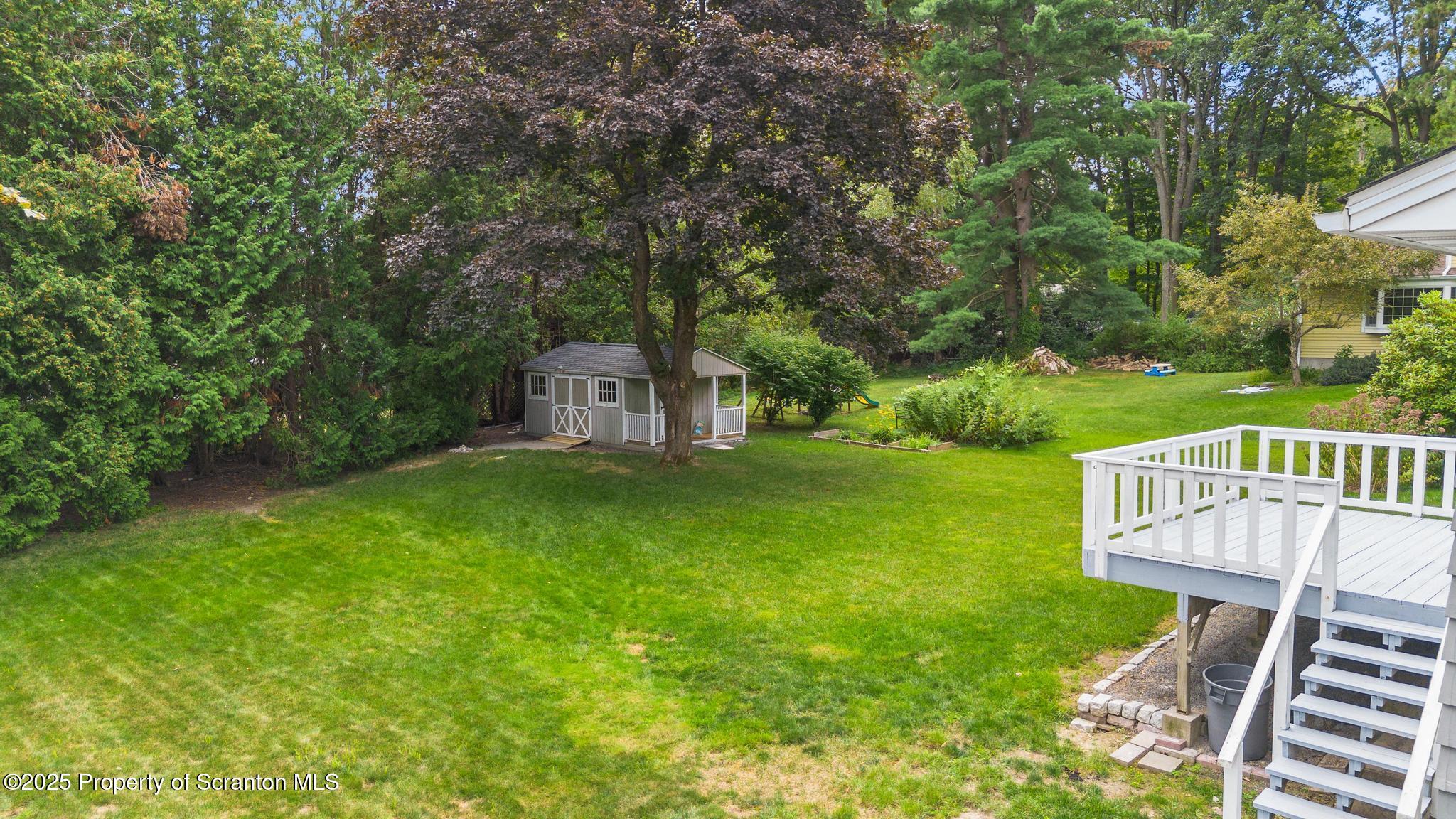 525 Knapp Road Clarks Summit, PA 18411 - Photo 40 of 45 a view of a deck and backyard with green space