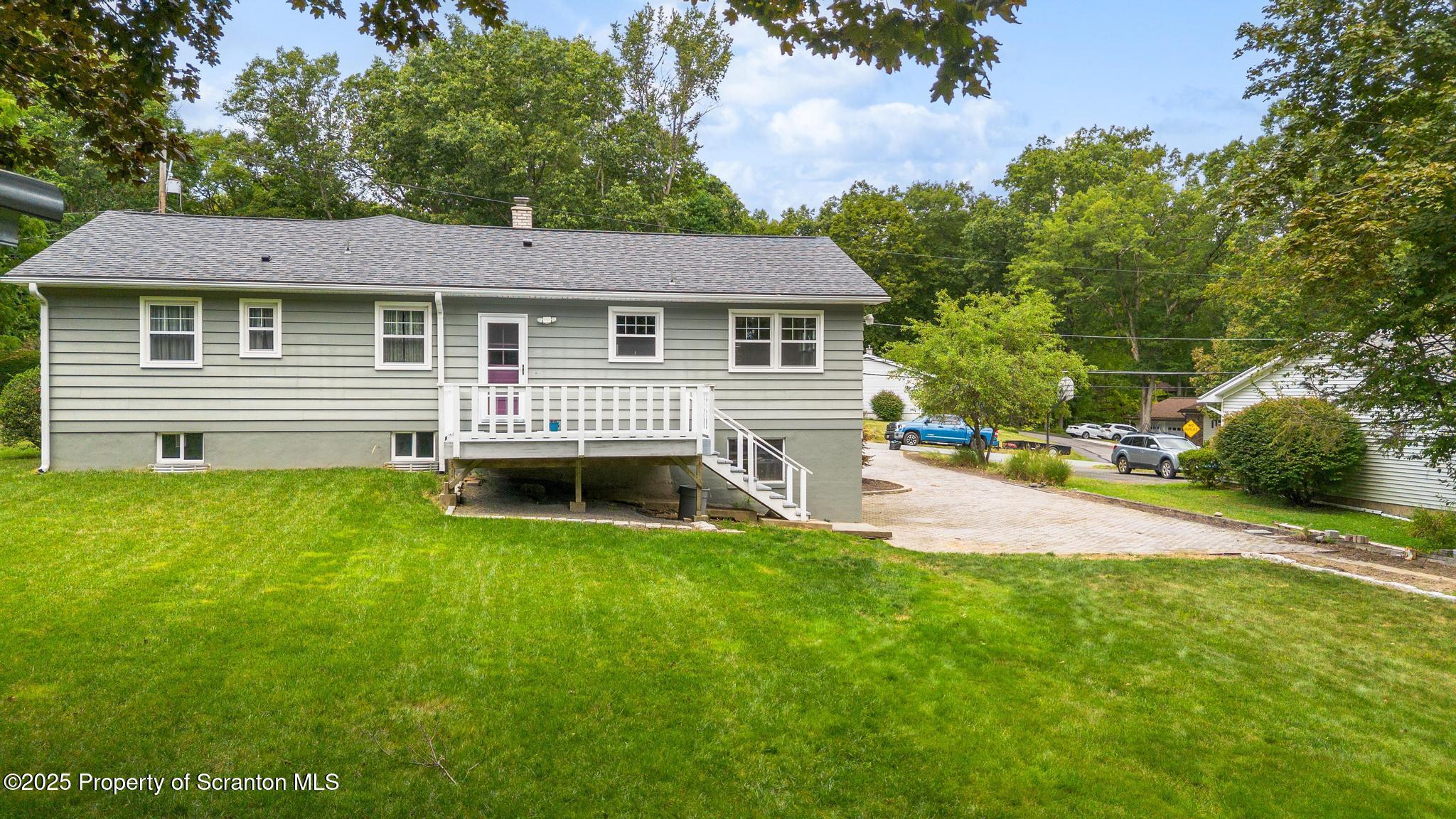 525 Knapp Road Clarks Summit, PA 18411 - Photo 41 of 45 a front view of a house with a garden and yard