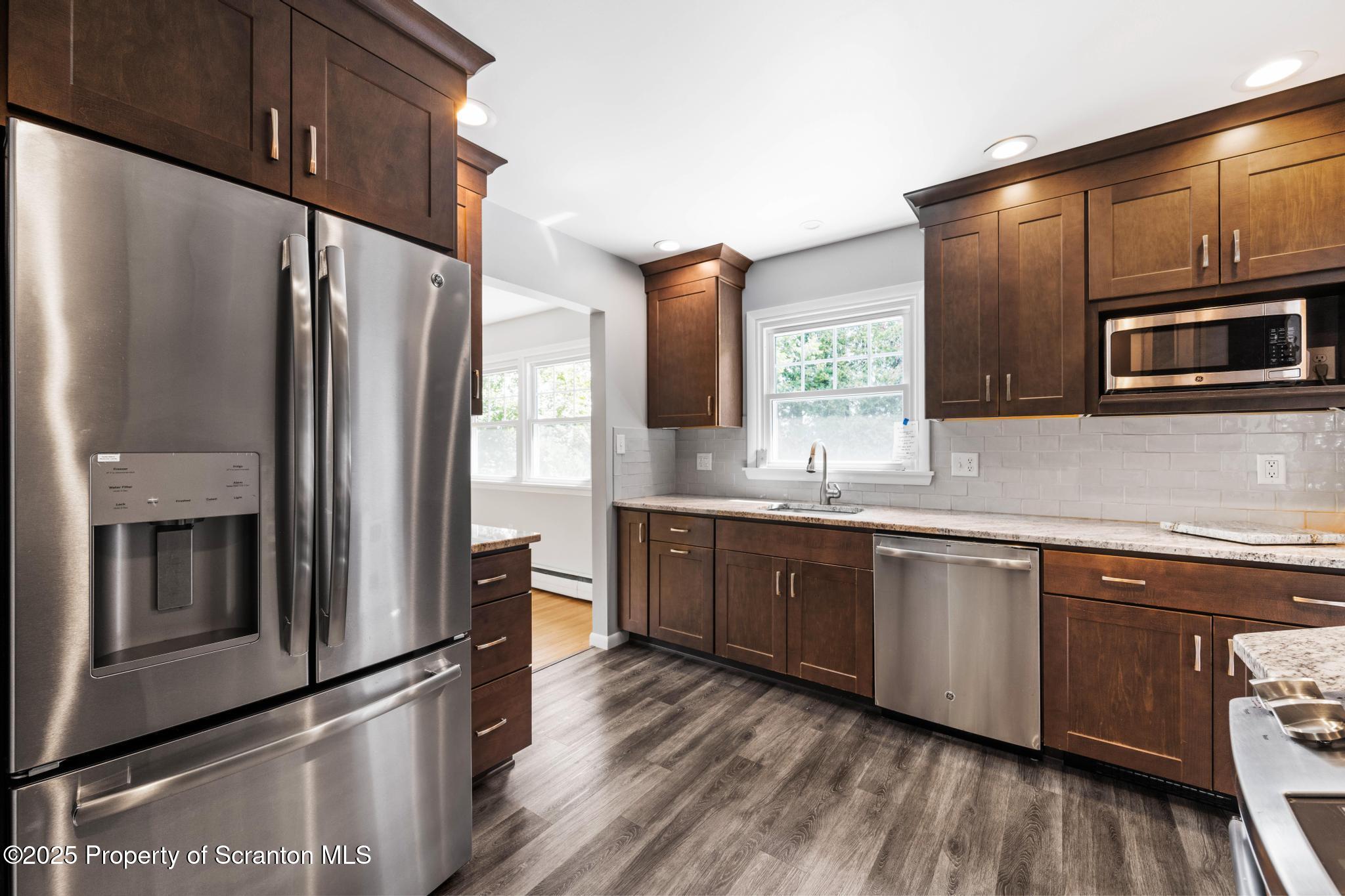 525 Knapp Road Clarks Summit, PA 18411 - Photo 10 of 45 a kitchen with stainless steel appliances granite countertop a refrigerator microwave and sink
