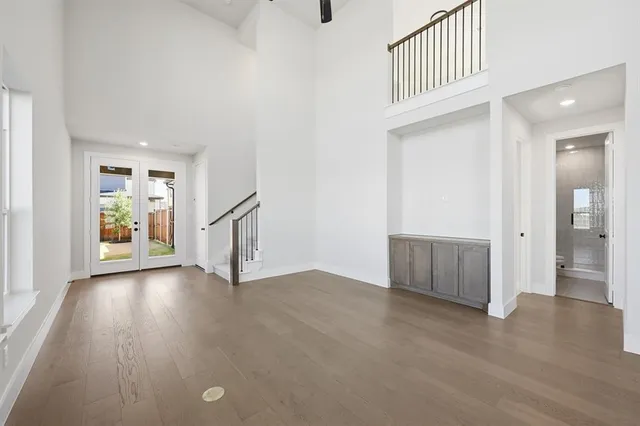 a bathroom with a white tub a sink and glass door