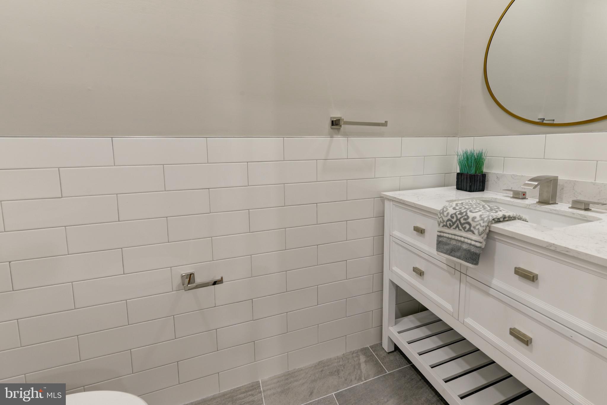 135 East Springer Street Philadelphia, PA 19119 - Photo 20 of 32 a bathroom with a sink and a mirror