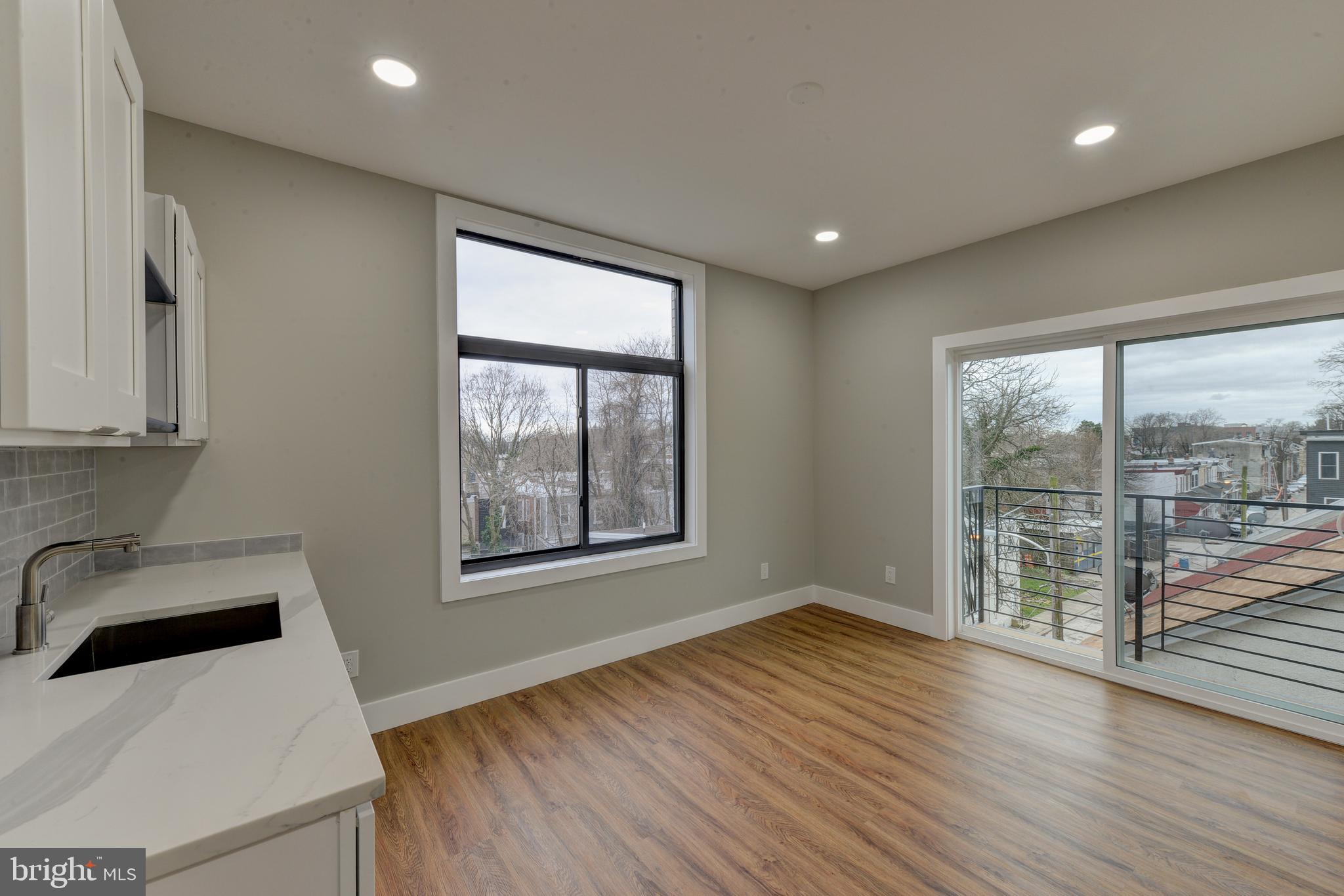 135 East Springer Street Philadelphia, PA 19119 - Photo 22 of 32 wooden floor in an empty room with a window