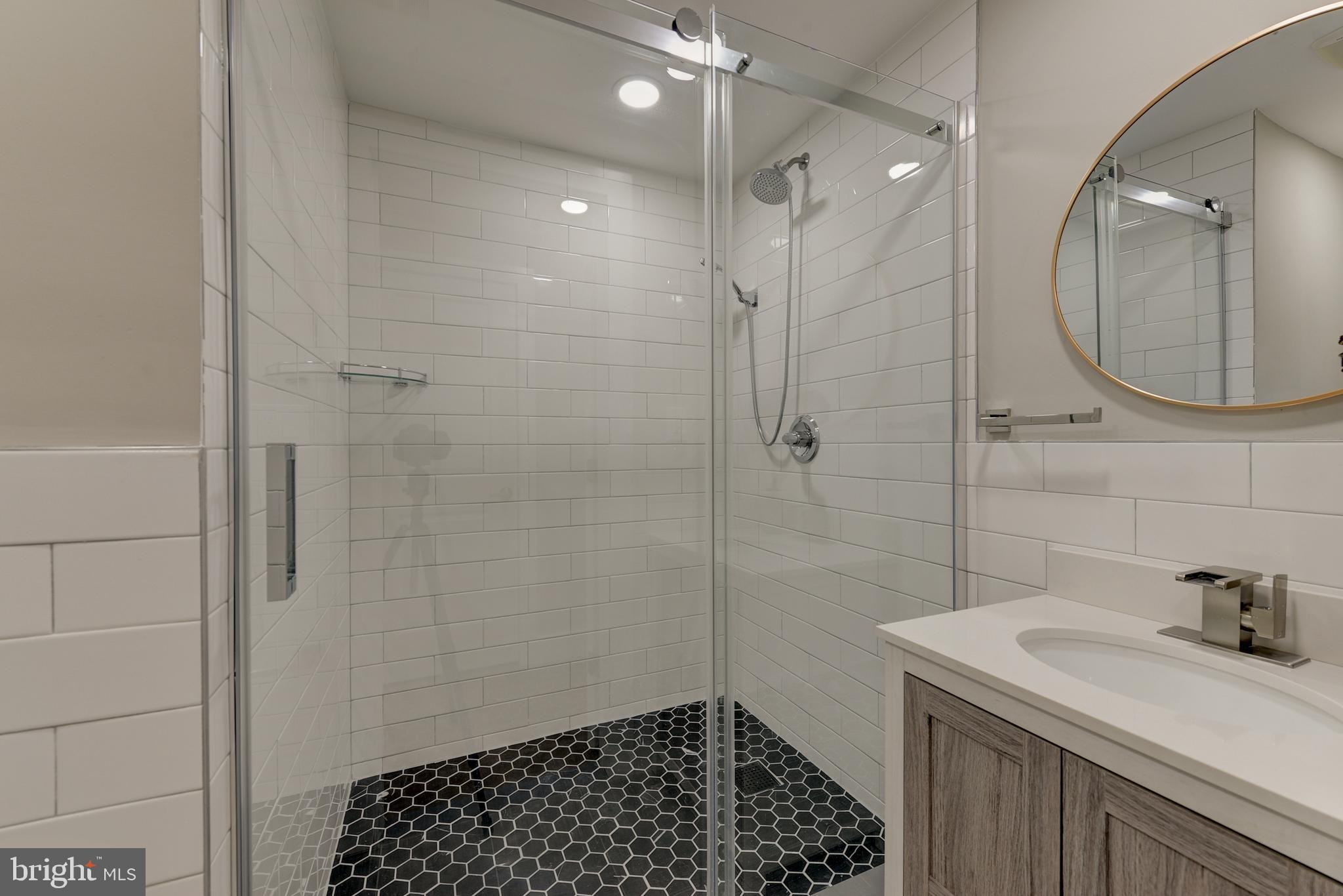 135 East Springer Street Philadelphia, PA 19119 - Photo 27 of 32 a bathroom with a sink a toilet and shower