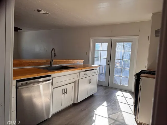 a kitchen with a sink and refrigerator