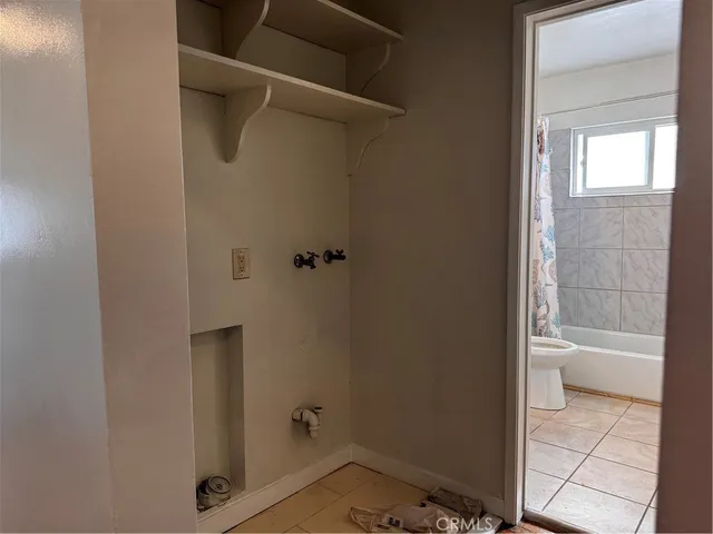 a bathroom with a granite countertop sink