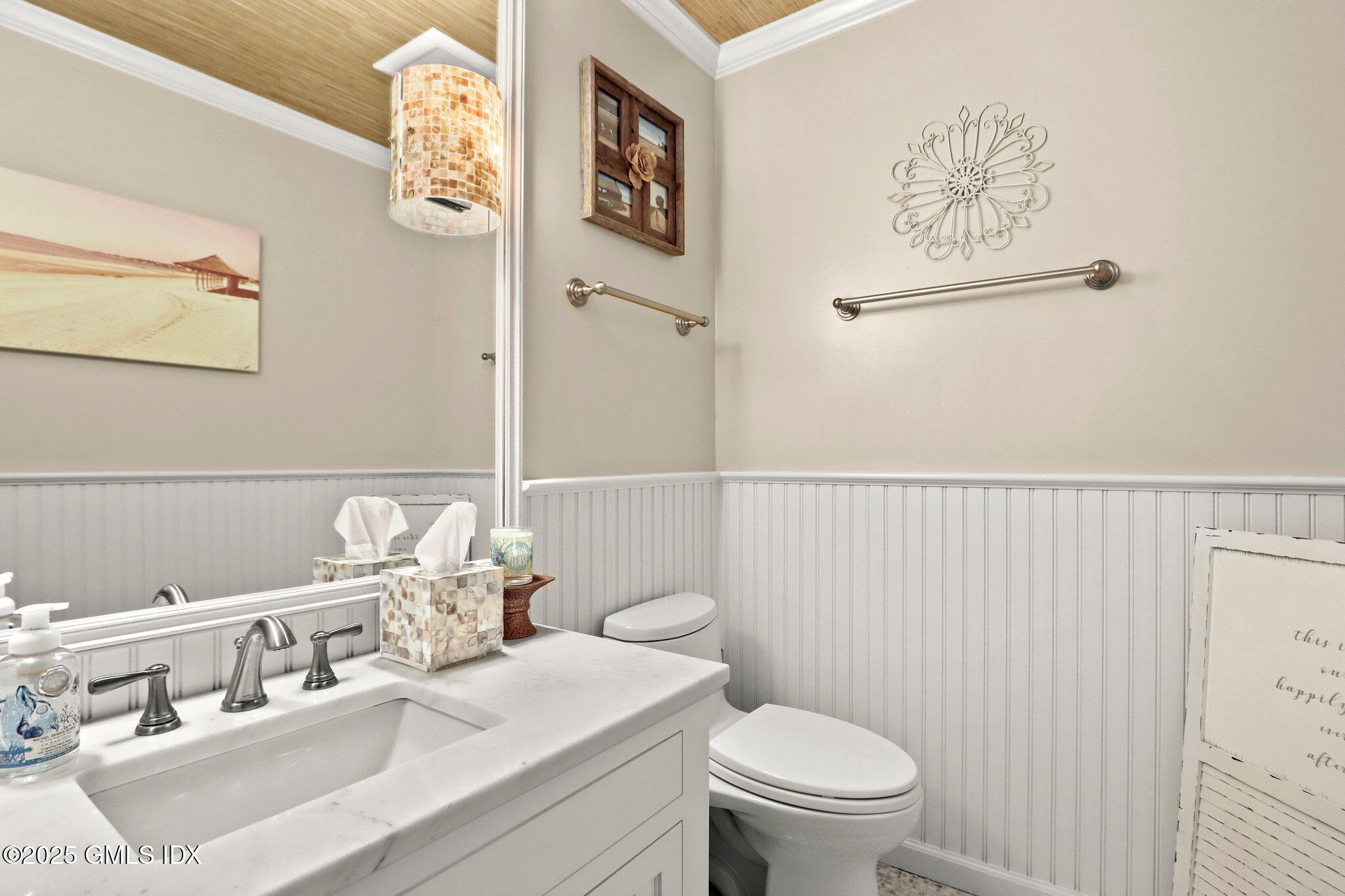 12 Old Forge Road Greenwich, CT 06830 - Photo 13 of 34 a bathroom with a sink mirror vanity and toilet