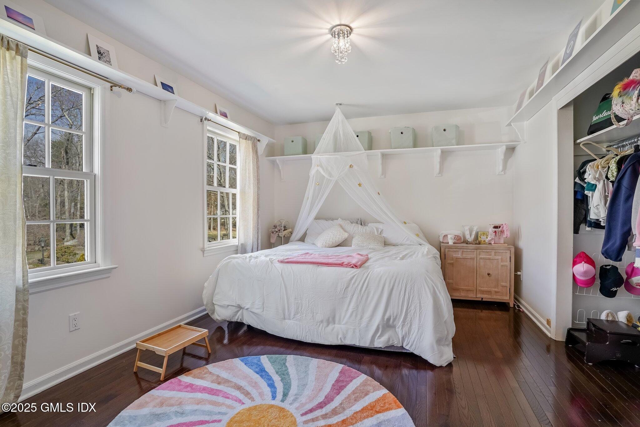 12 Old Forge Road Greenwich, CT 06830 - Photo 18 of 34 a bedroom with a bed and a window