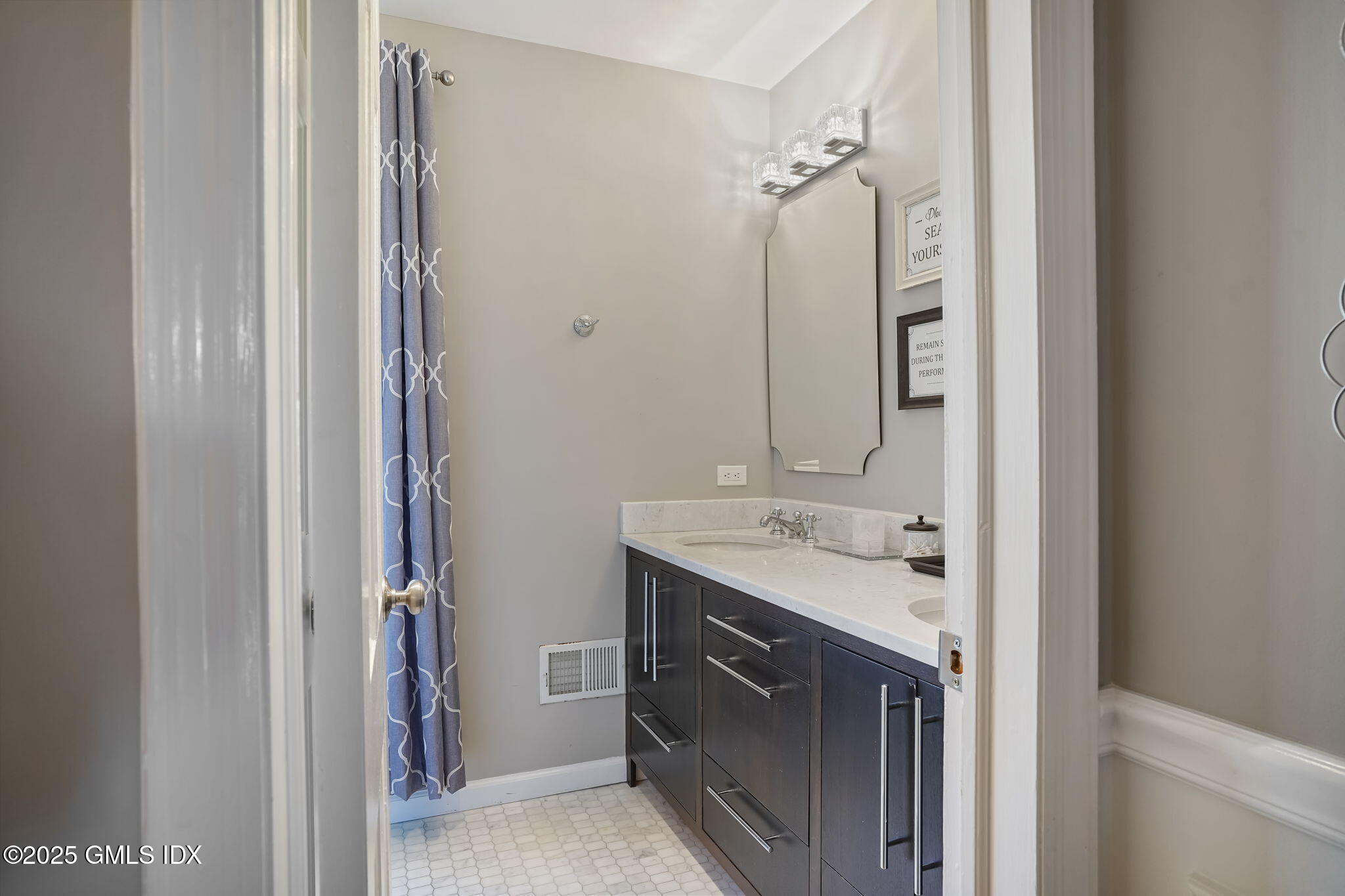 12 Old Forge Road Greenwich, CT 06830 - Photo 21 of 34 a bathroom with a double vanity sink mirror and shower