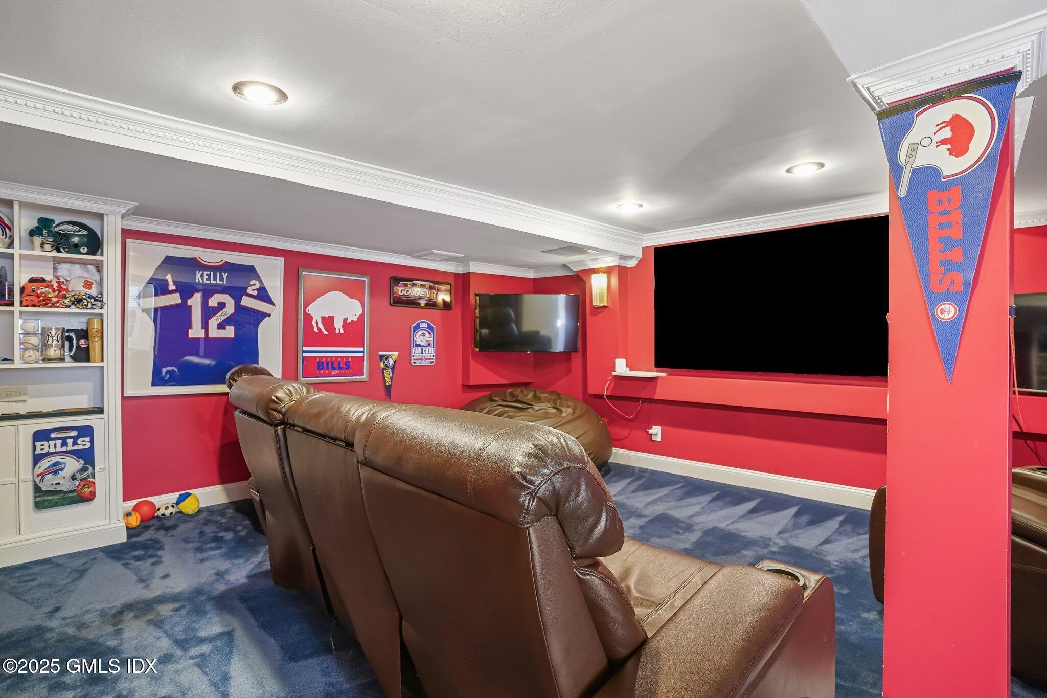 12 Old Forge Road Greenwich, CT 06830 - Photo 25 of 34 a living room with furniture and a flat screen tv