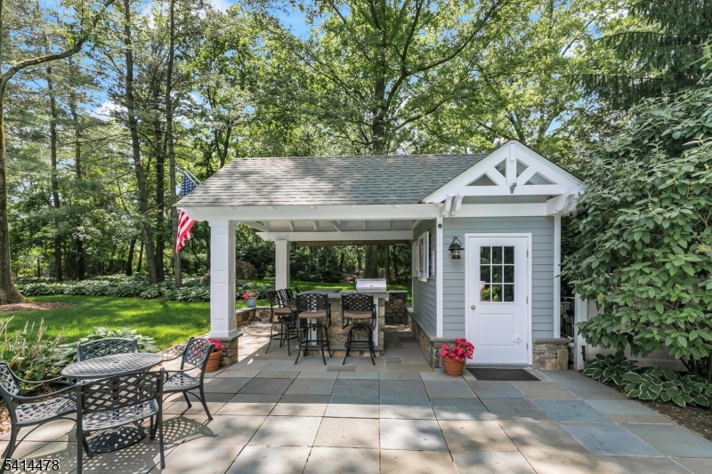 33 St Nickolas Way Bernards, NJ 07920 - Photo 40 of 50 a view of a patio with table and chairs potted plants and large tree