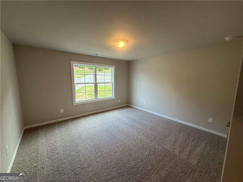 352 Lakeside Drive Canton, GA 30115 - Photo 14 of 16 an empty room with a window