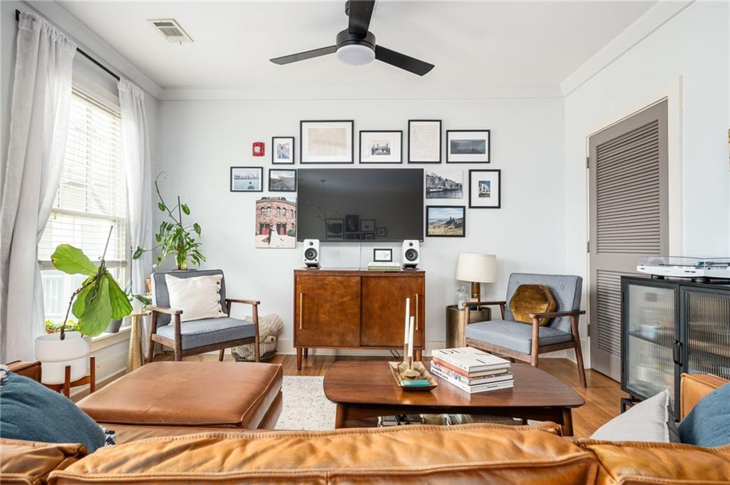 1628 Briarcliff Road Northeast, Unit 9 Atlanta, GA 30306 - Photo 11 of 25 a living room with furniture and a flat screen tv