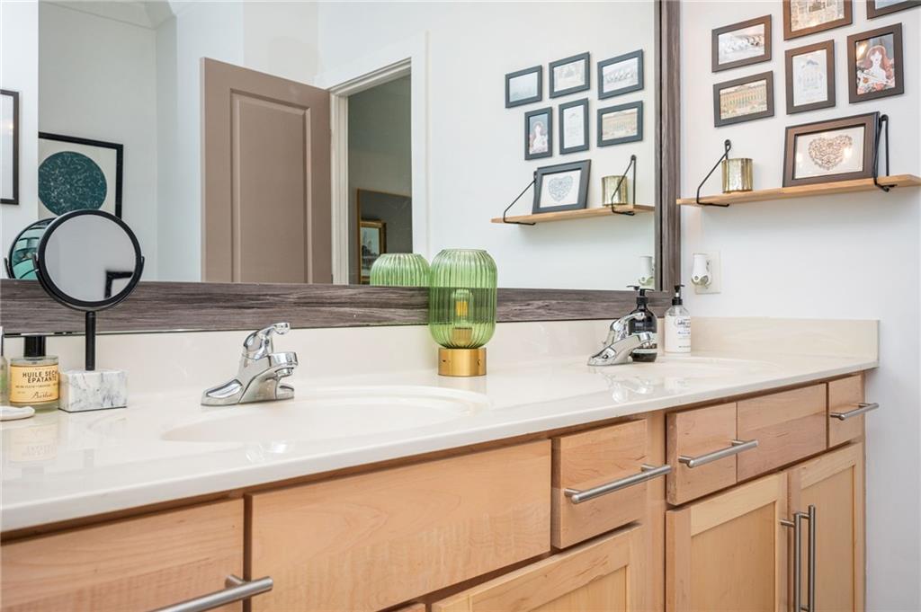 1628 Briarcliff Road Northeast, Unit 9 Atlanta, GA 30306 - Photo 21 of 25 a bathroom with a sink and a mirror