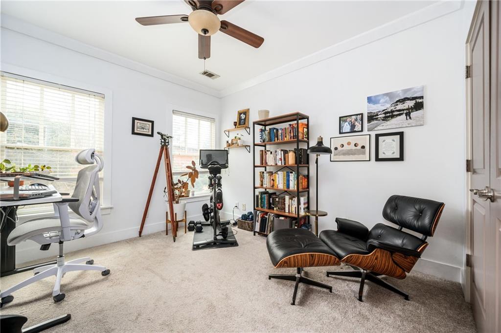 1628 Briarcliff Road Northeast, Unit 9 Atlanta, GA 30306 - Photo 22 of 25 a view of a workspace with furniture and a window