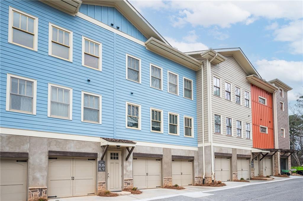 1628 Briarcliff Road Northeast, Unit 9 Atlanta, GA 30306 - Photo 3 of 25 a front view of a building with parking space