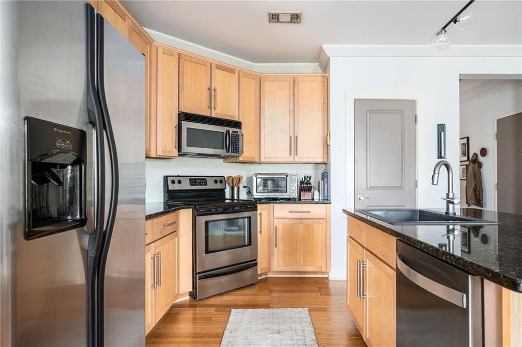1628 Briarcliff Road Northeast, Unit 9 Atlanta, GA 30306 - Photo 7 of 25 a kitchen with a sink stove and refrigerator