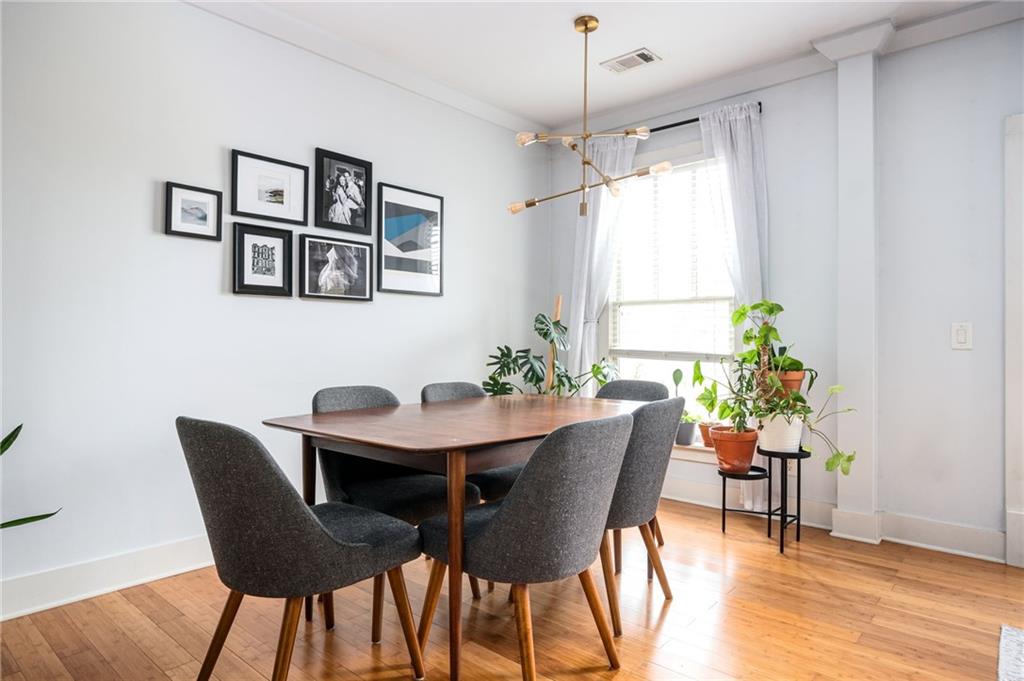 1628 Briarcliff Road Northeast, Unit 9 Atlanta, GA 30306 - Photo 8 of 25 a view of a dining room with furniture window and wooden floor