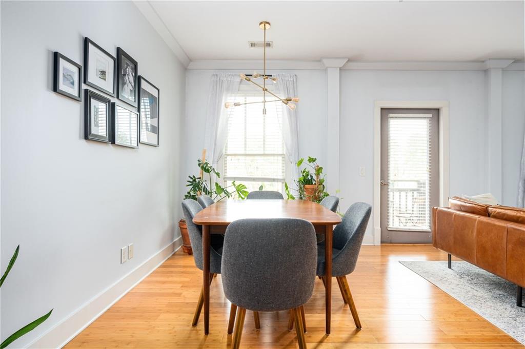 1628 Briarcliff Road Northeast, Unit 9 Atlanta, GA 30306 - Photo 9 of 25 a view of a dining room with furniture window and wooden floor