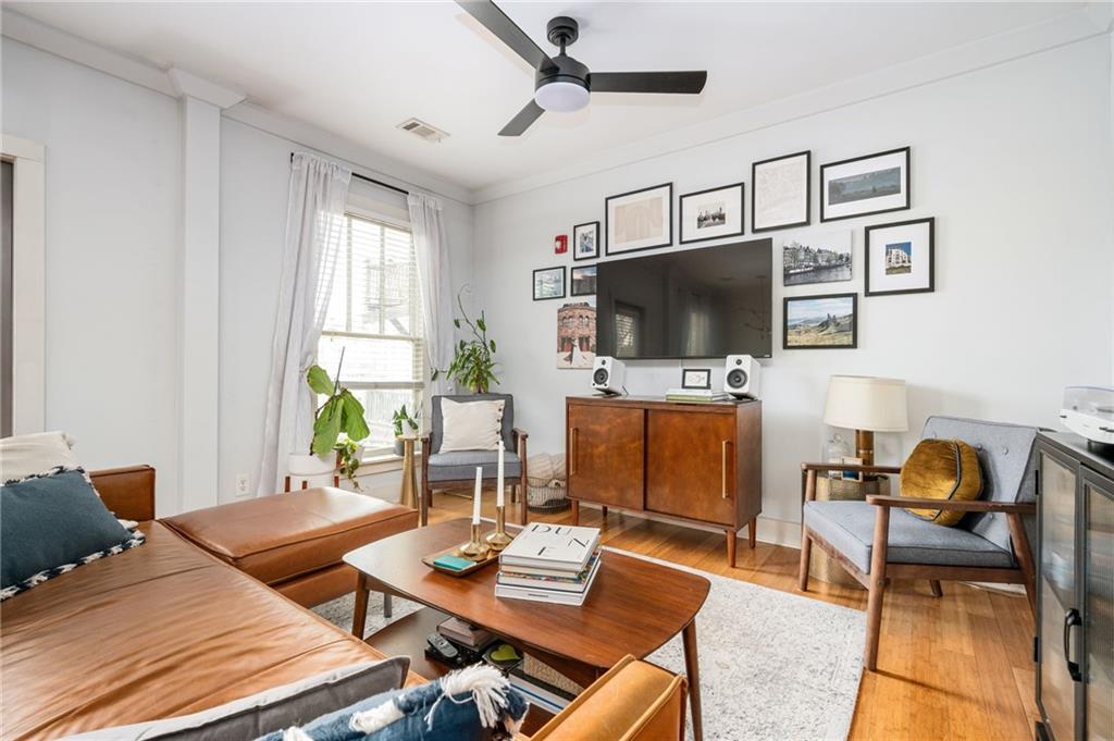 1628 Briarcliff Road Northeast, Unit 9 Atlanta, GA 30306 - Photo 10 of 25 a living room with furniture and a flat screen tv