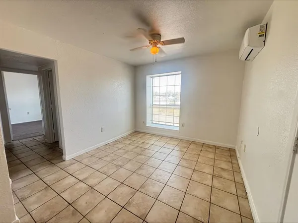 a view of an empty room and window