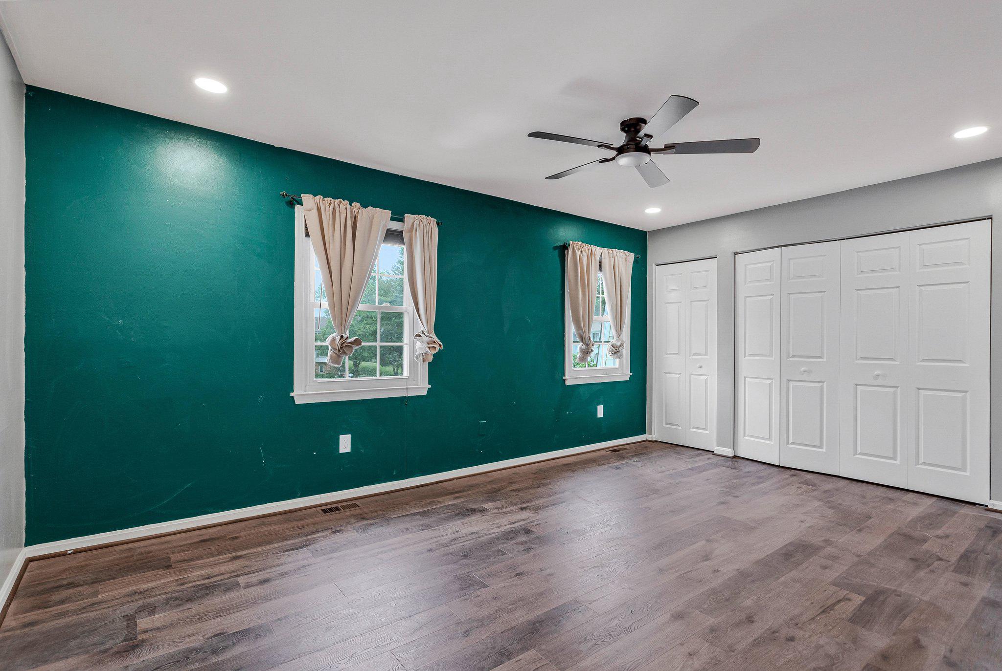 1675 Ridgely Court, Unit 182 Crofton, MD 21114 - Photo 34 of 47 wooden floor in an empty room with a window