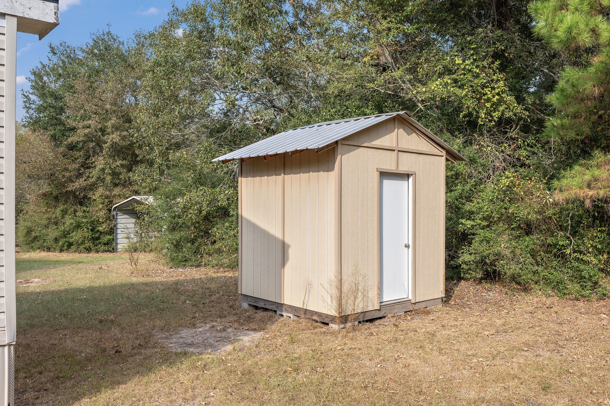 6493 Pappas Road Waller, TX 77484 - Photo 24 of 28 Detached storage shed on acreage, providing secure space for tools, landscaping equipment, or outdoor hobbies.