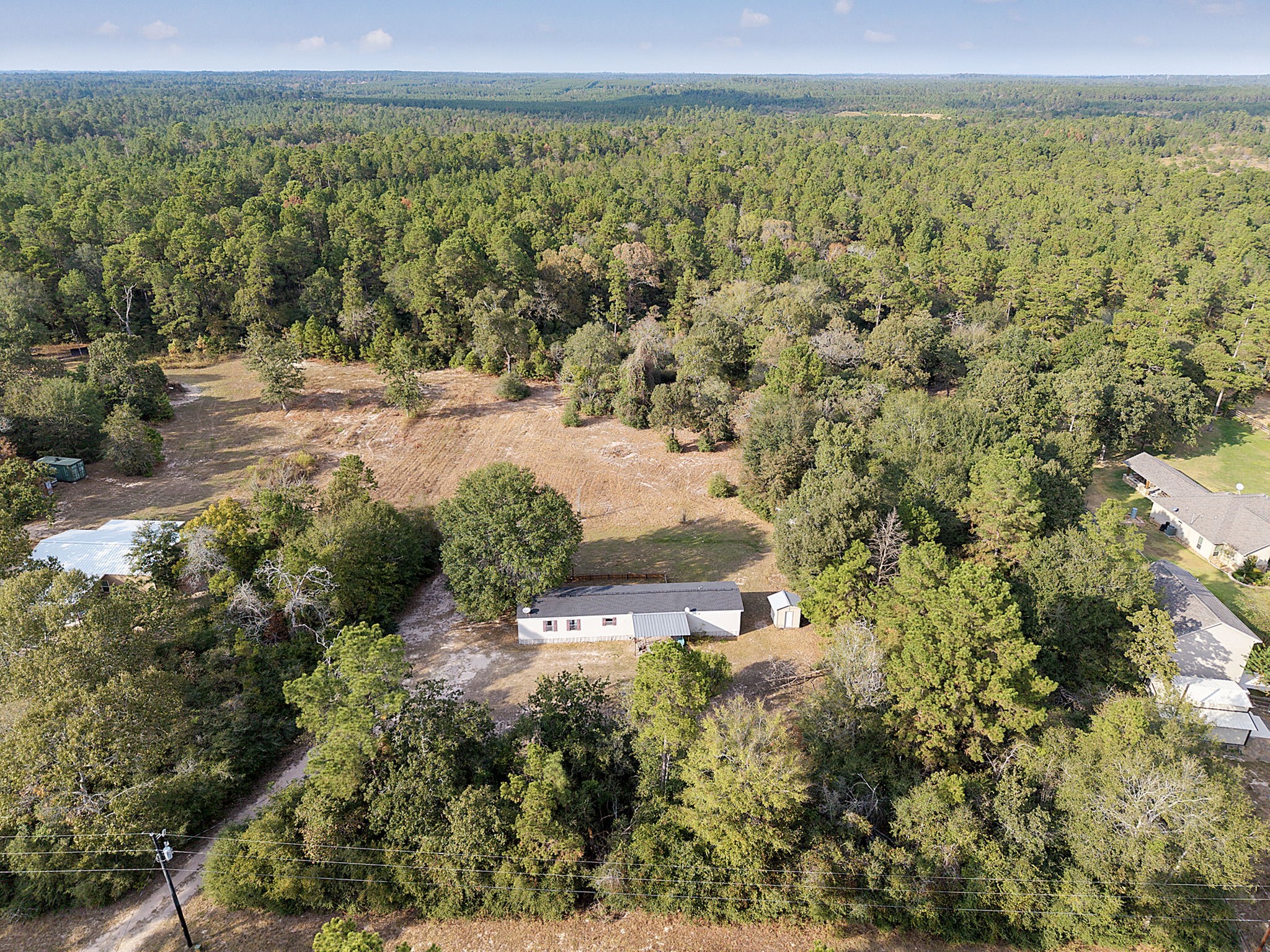 6493 Pappas Road Waller, TX 77484 - Photo 5 of 28 Wide aerial shot showing 101,059 sq. ft. lot in Grimes County—enjoy lower tax rates while staying close to Waller amenities.