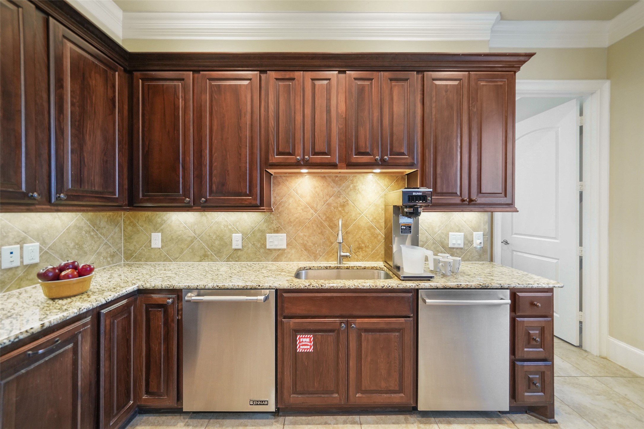 26250 A Riley Road Waller, TX 77484 - Photo 38 of 50 Secondary kitchen workspace with granite counters, built-in cabinetry, and dual dishwashers—streamlines prep for events and gatherings.