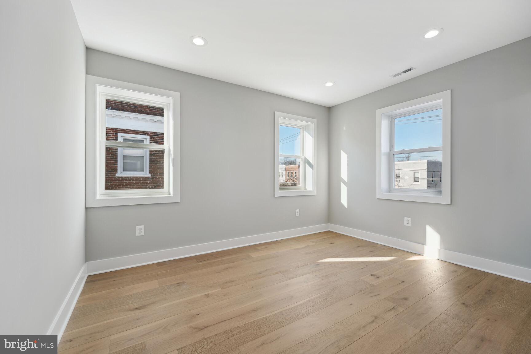 704 Rittenhouse Street Northwest Washington, DC 20011 - Photo 15 of 29 a view of a big room with wooden floor and windows
