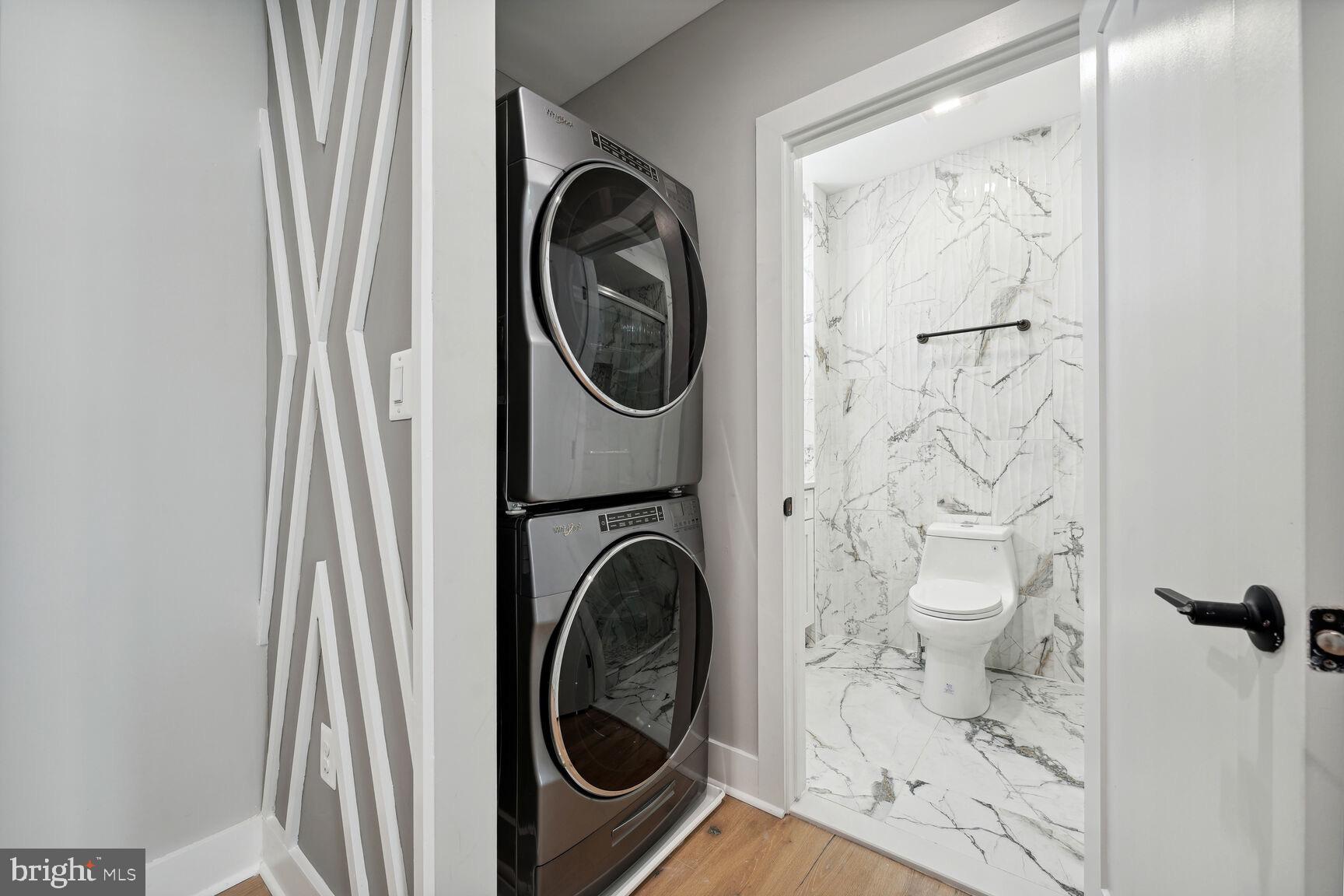 704 Rittenhouse Street Northwest Washington, DC 20011 - Photo 17 of 29 a view of a bathroom with a washer and dryer