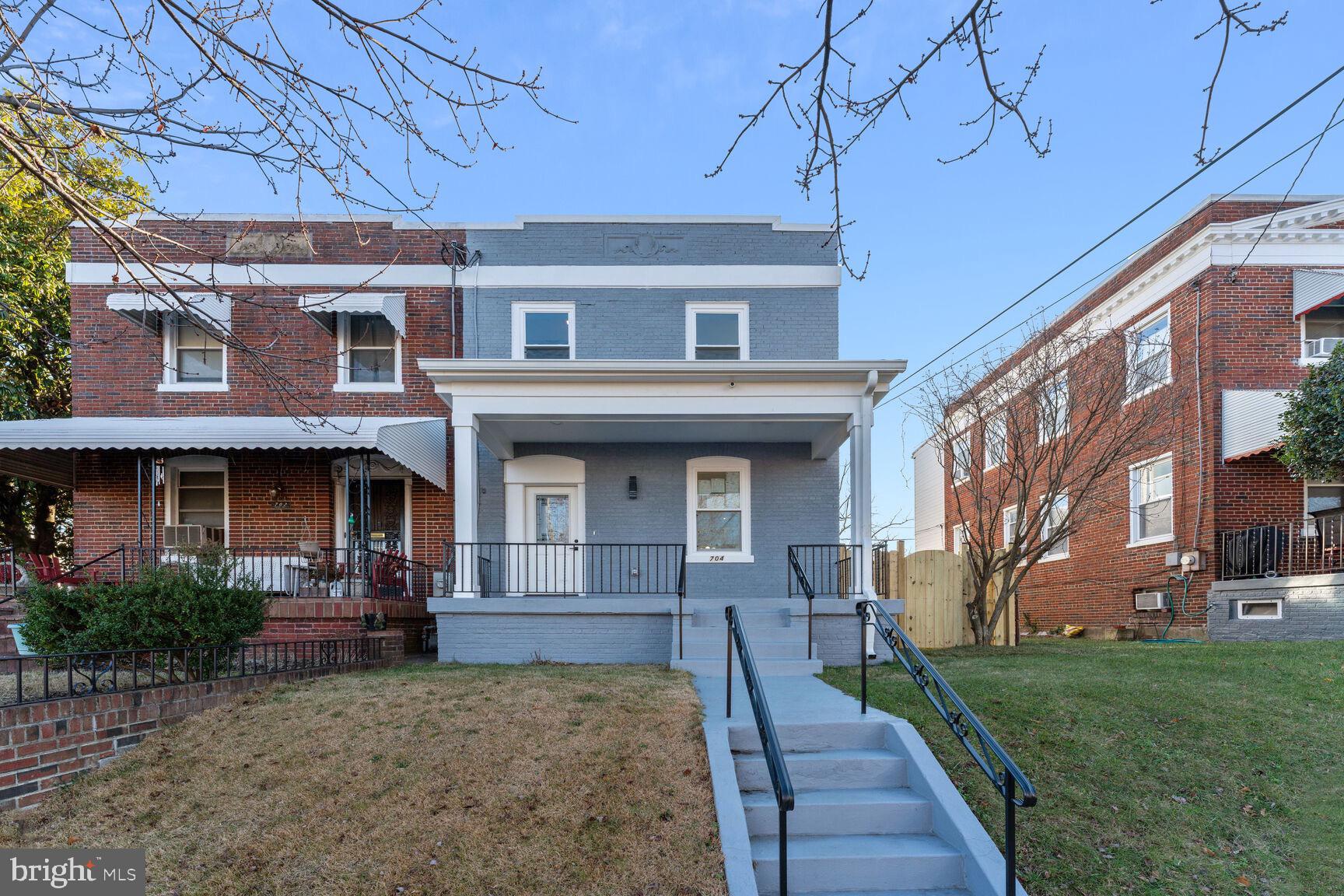 704 Rittenhouse Street Northwest Washington, DC 20011 - Photo 2 of 29 a front view of a house with garden