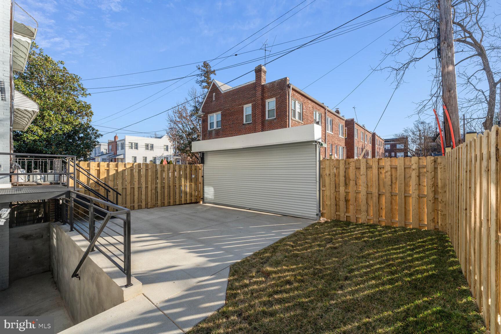 704 Rittenhouse Street Northwest Washington, DC 20011 - Photo 28 of 29 a view of a house with backyard and sitting area