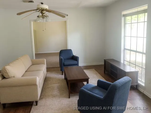 a living room with furniture and a window