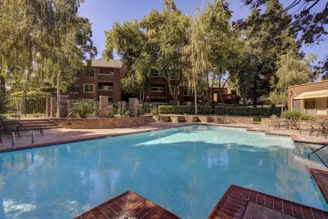 a view of a swimming pool with a patio