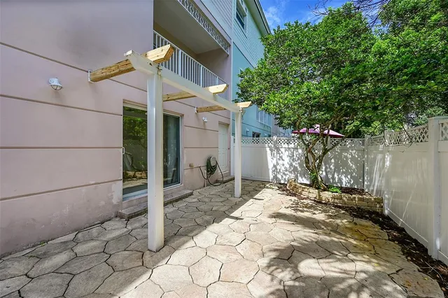 an aerial view of residential houses with outdoor space and street view