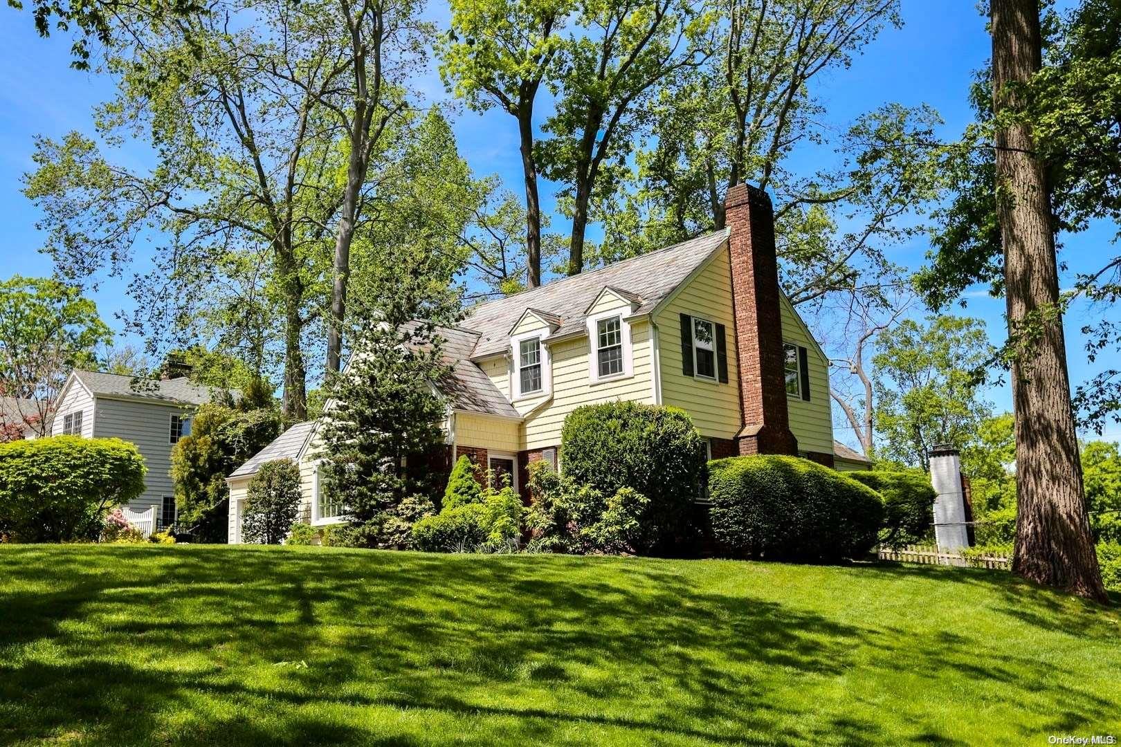 91 Longridge Road Manhasset, NY 11030 - Photo 1 of 1 a front view of a house with a garden