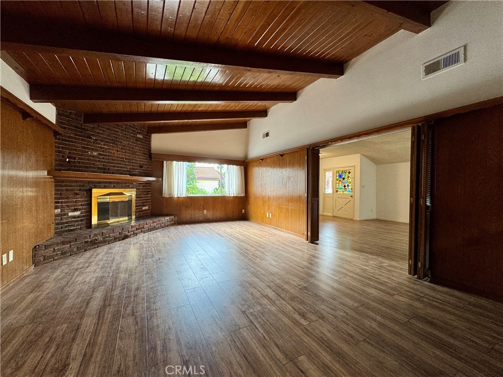 320 North Stoneman Avenue, Unit A Alhambra, CA 91801 - Photo 4 of 14 a view of a livingroom with wooden floor and fireplace