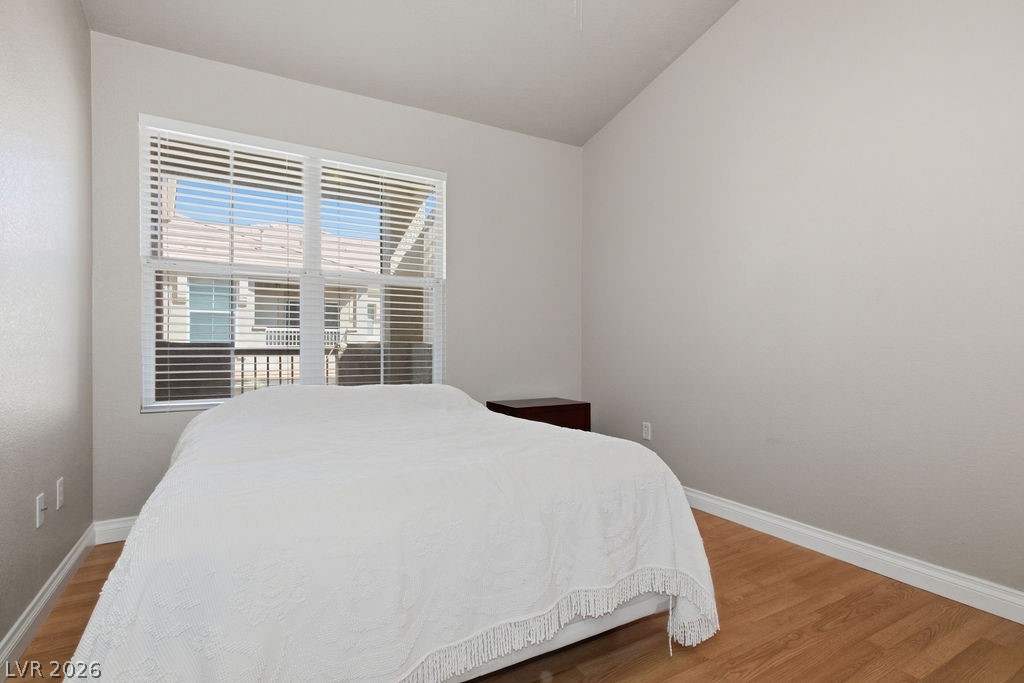 10550 West Alexander Road, Unit 2133 Las Vegas, NV 89129 - Photo 27 of 42 This serene bedroom offers a bright window and comfortable flooring, perfect for relaxation.