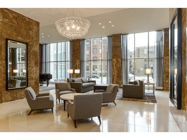 655 West Irving Park Road, Unit 2508 Chicago, IL 60613 - Photo 2 of 20 a living room with furniture and a large window