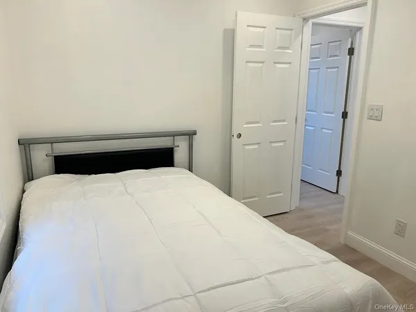 a bedroom with a bed and a table