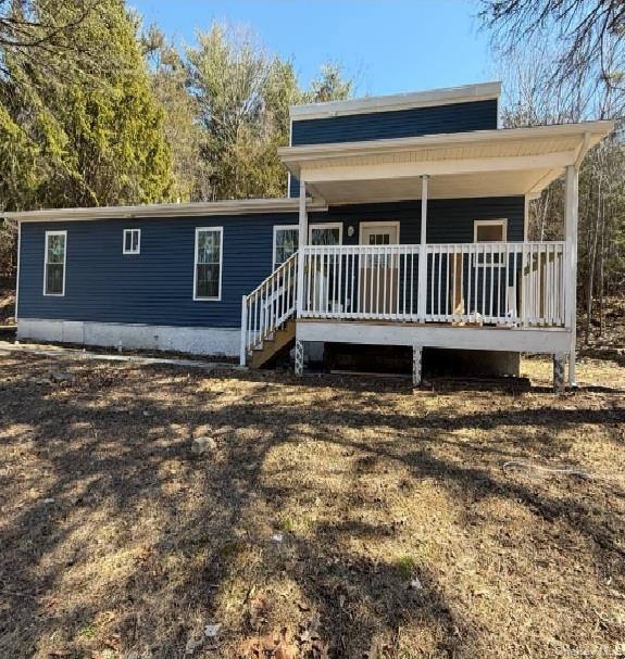 82 High Rock Road West Coxsackie, NY 12192 - Photo 2 of 23 a view of a house with a deck and a yard