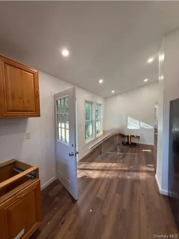 a view of a kitchen with a sink and a stove top oven