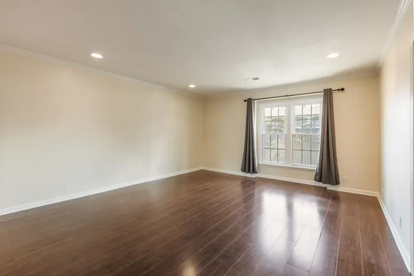 a bedroom with a large bed and a couch