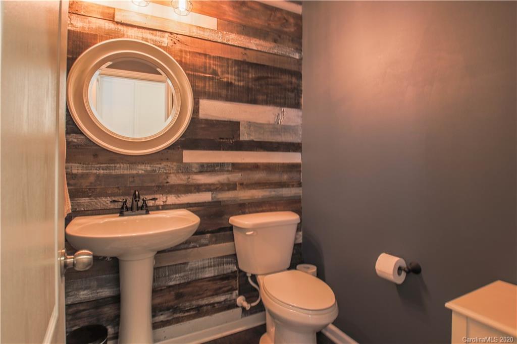 5149 Waterloo Drive Tega Cay, SC 29708 - Photo 11 of 28 a bathroom with a toilet sink and mirror